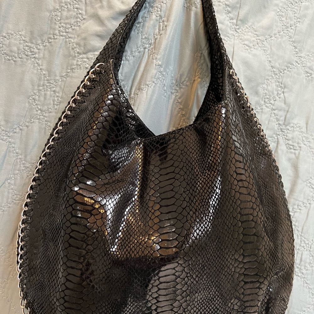 Michael Kors black leather python hobo bag with chain detail.